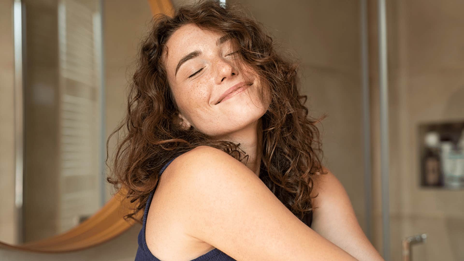 Young adult woman smiling because she was soft parented 