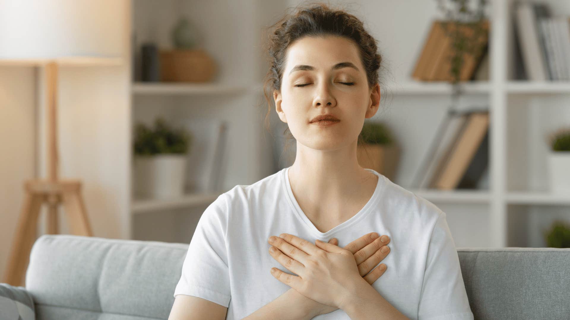 Young woman raised in soft parenting method meditates to stay calm