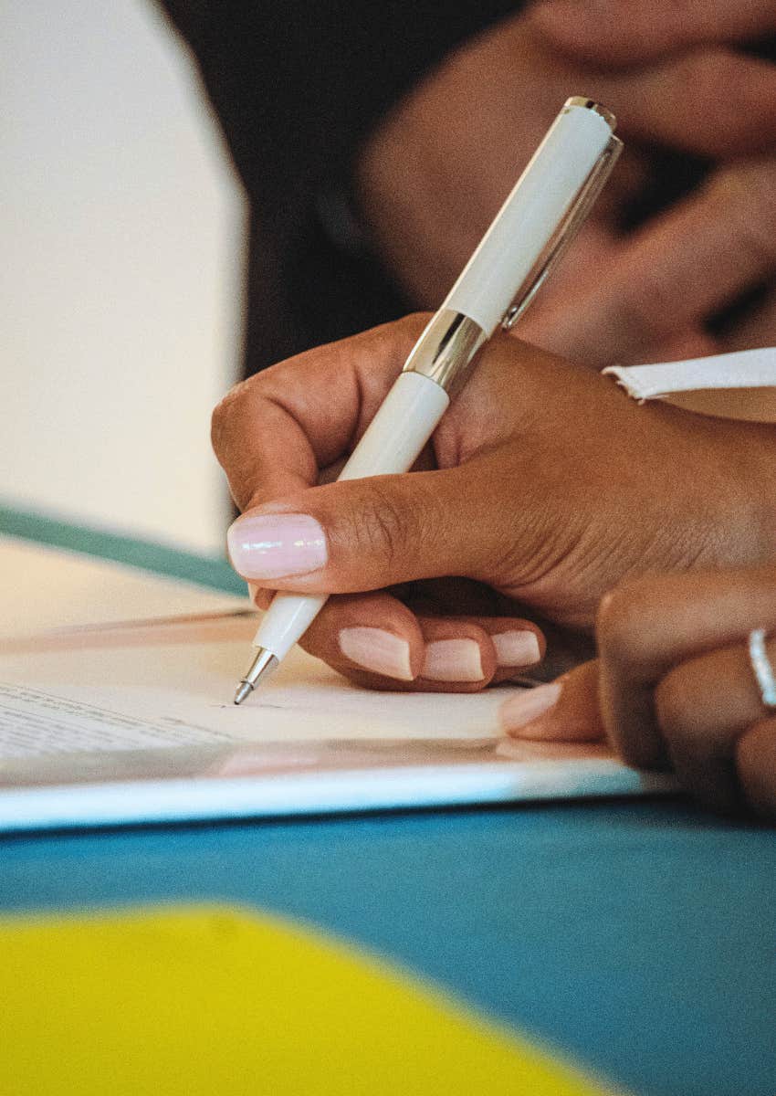 Doctor With Terminal Cancer Says These Things Are What Most People Wait Too Long To Do hands signing important documents