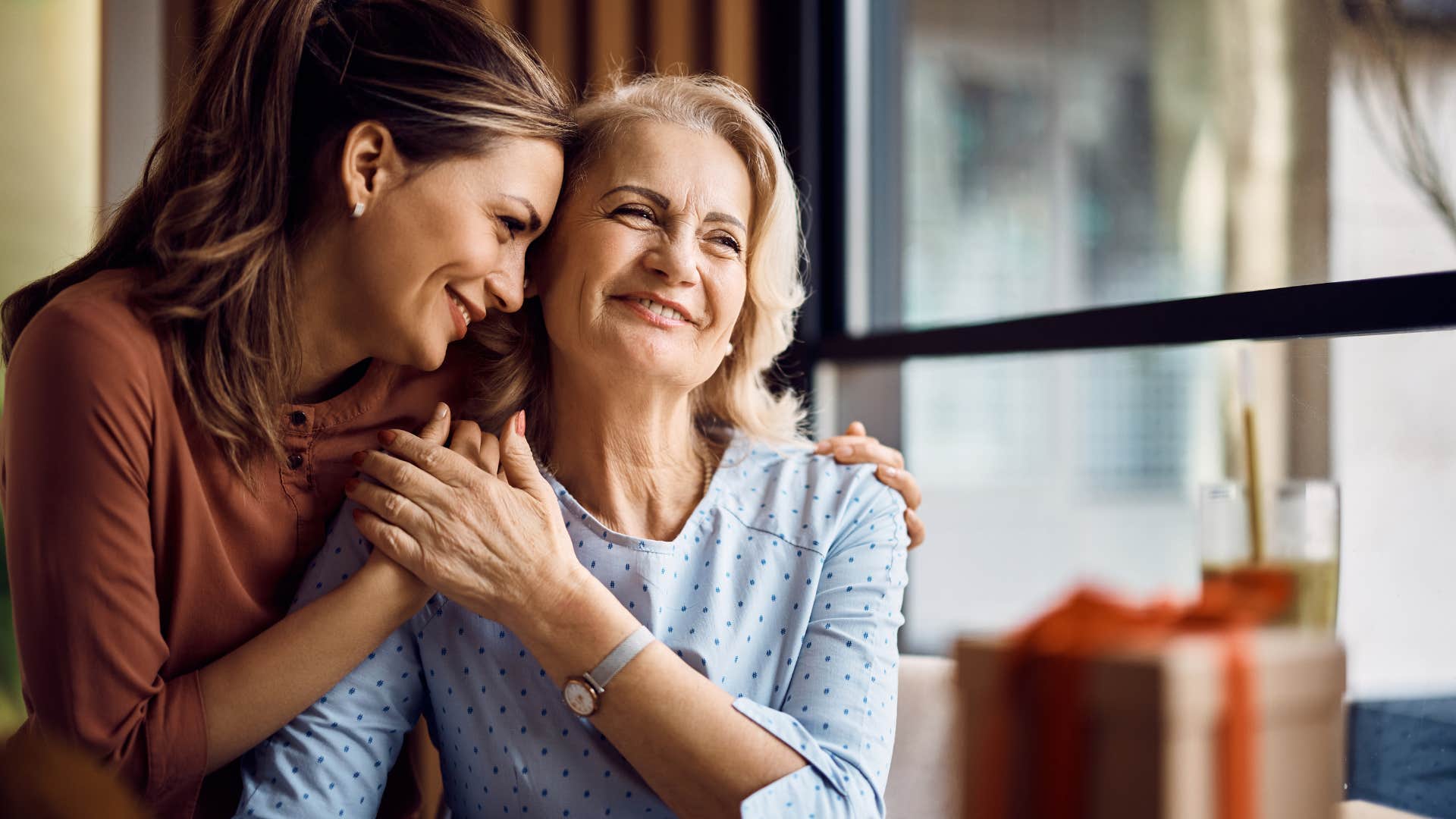 woman hugging mom after a long absence