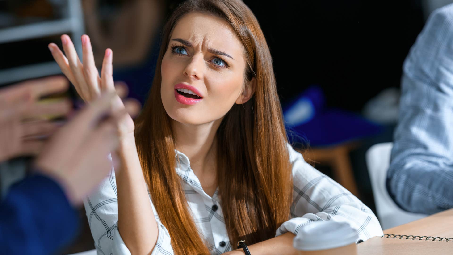 Negative woman at work is overwhelmed and exhausted 