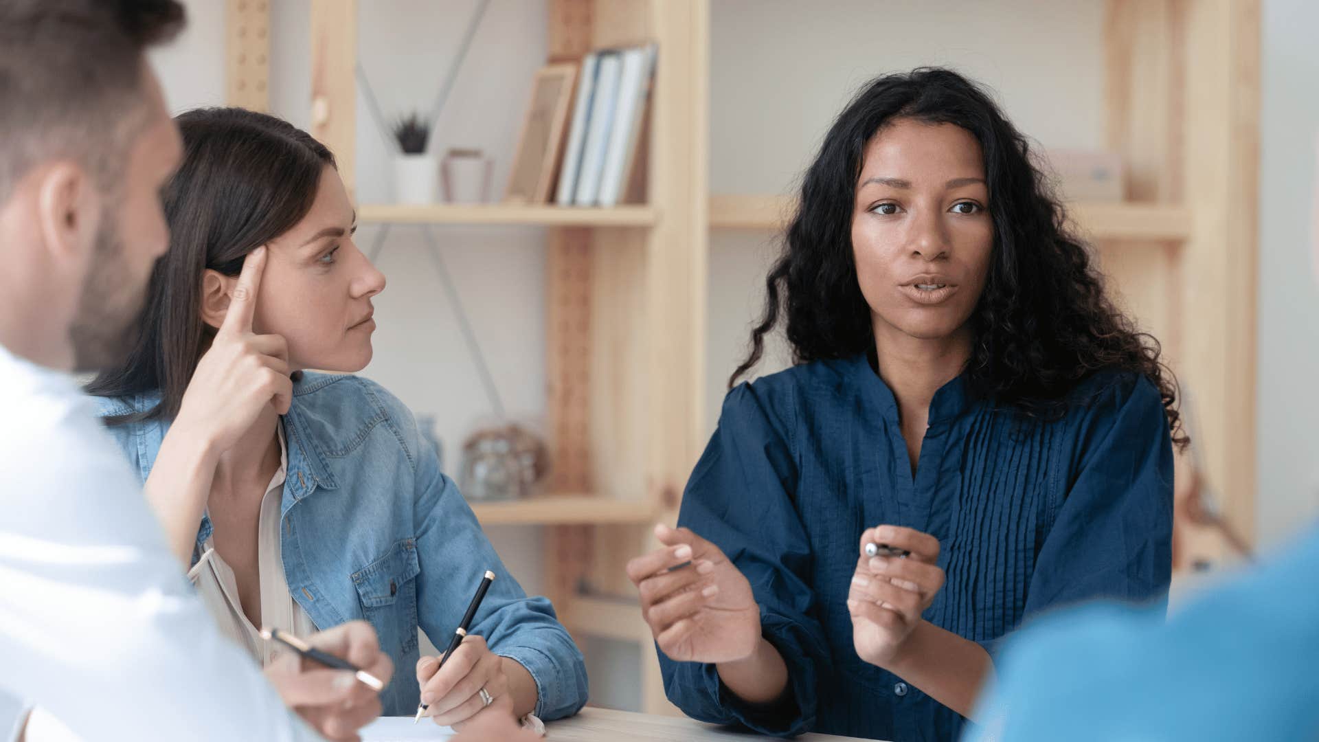 woman ruining a good first impression by interrupting colleagues