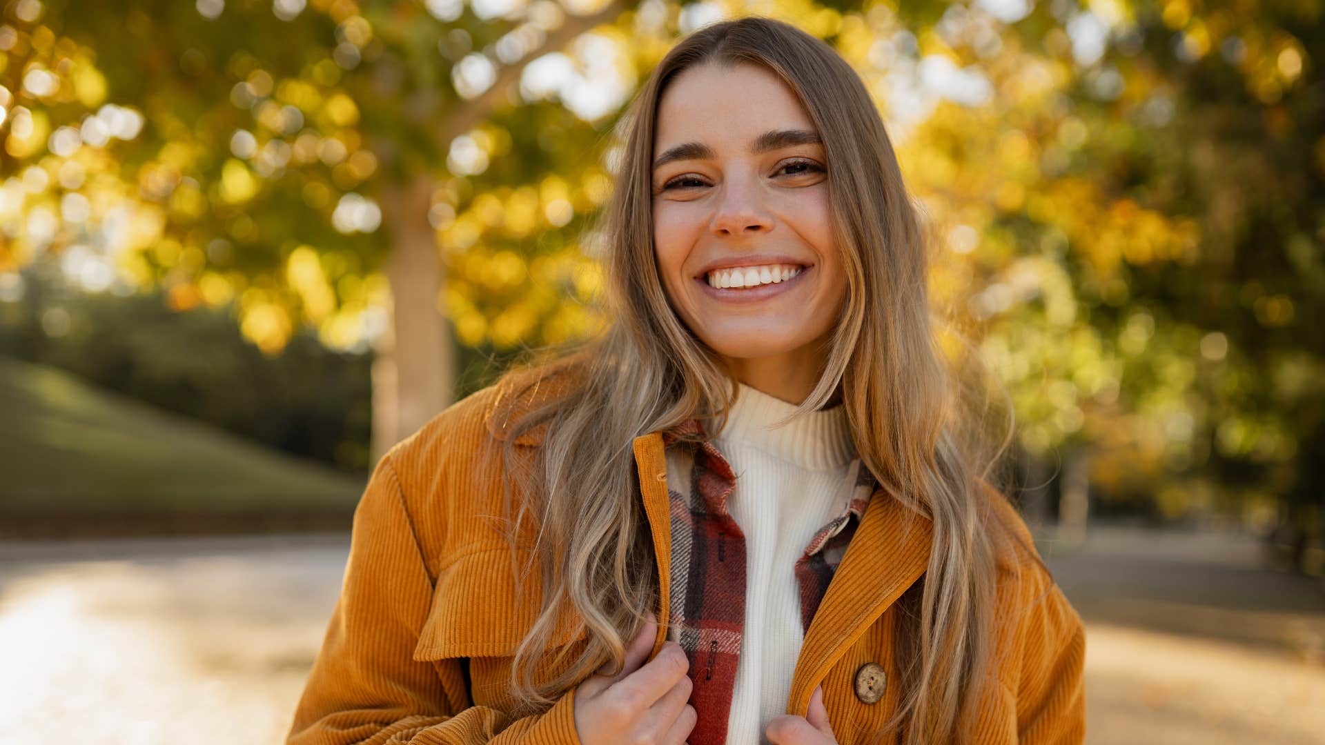 peaceful woman walking outside smiling
