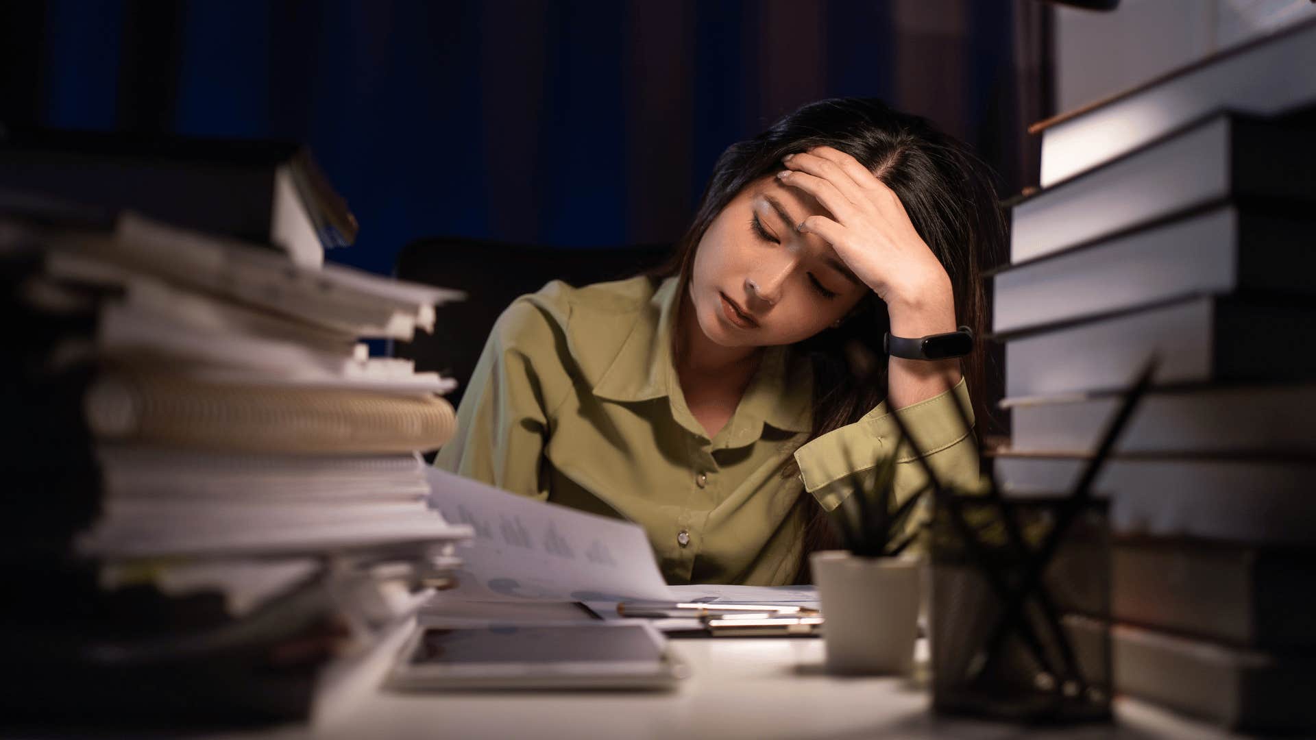 Stressed woman working late isn't lazy she's overwhelmed and exhausted 