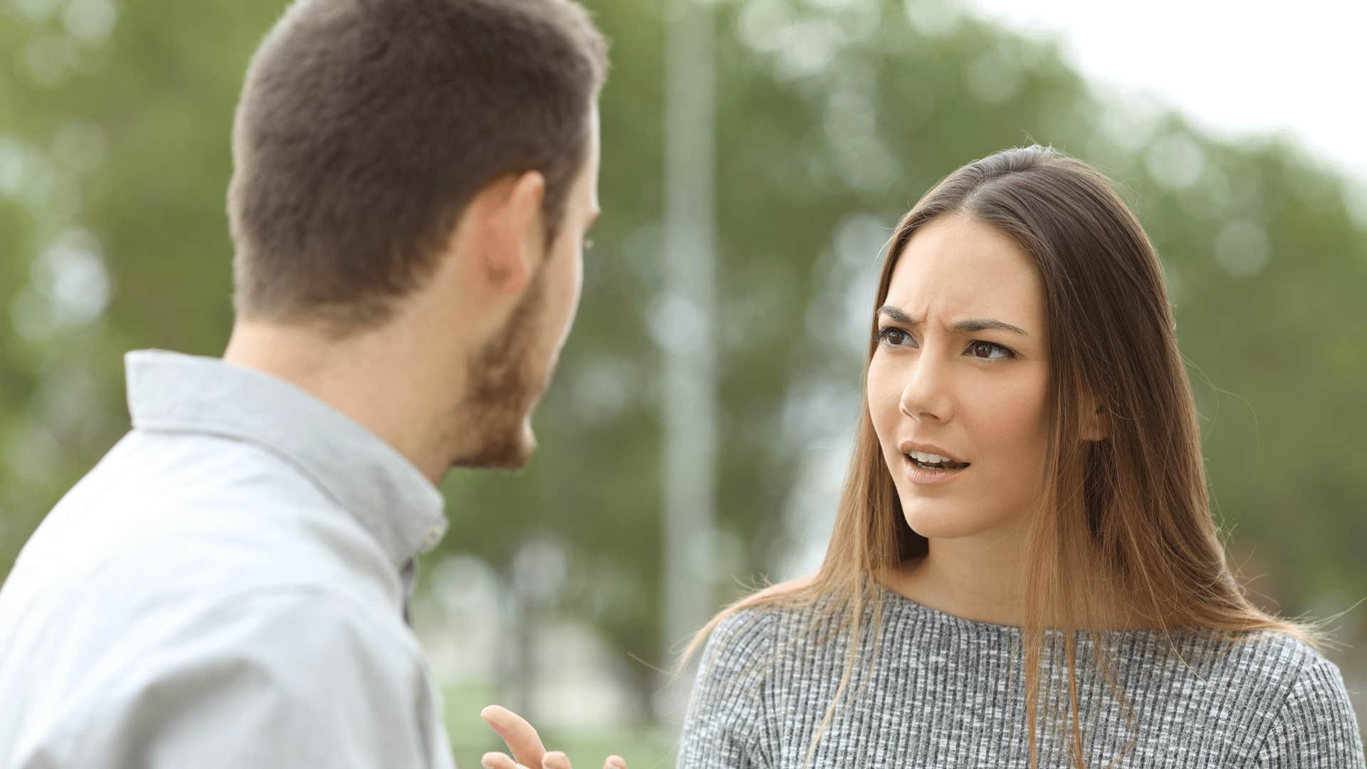 couple talking about logistics looking annoyed