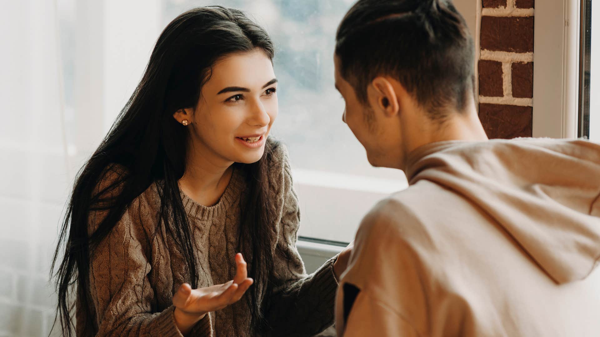 Adult child of divorced parents appeasing her partner 
