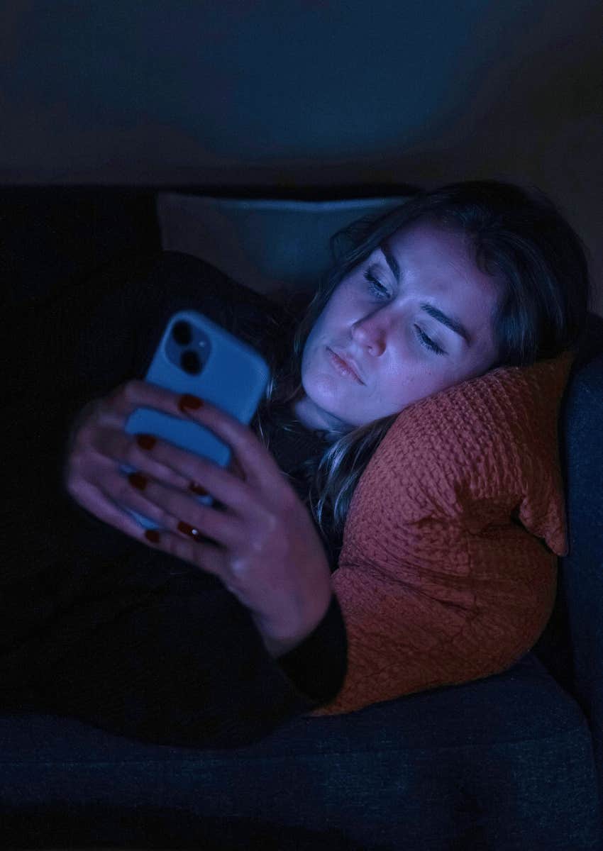 tired millennial scrolling through his phone