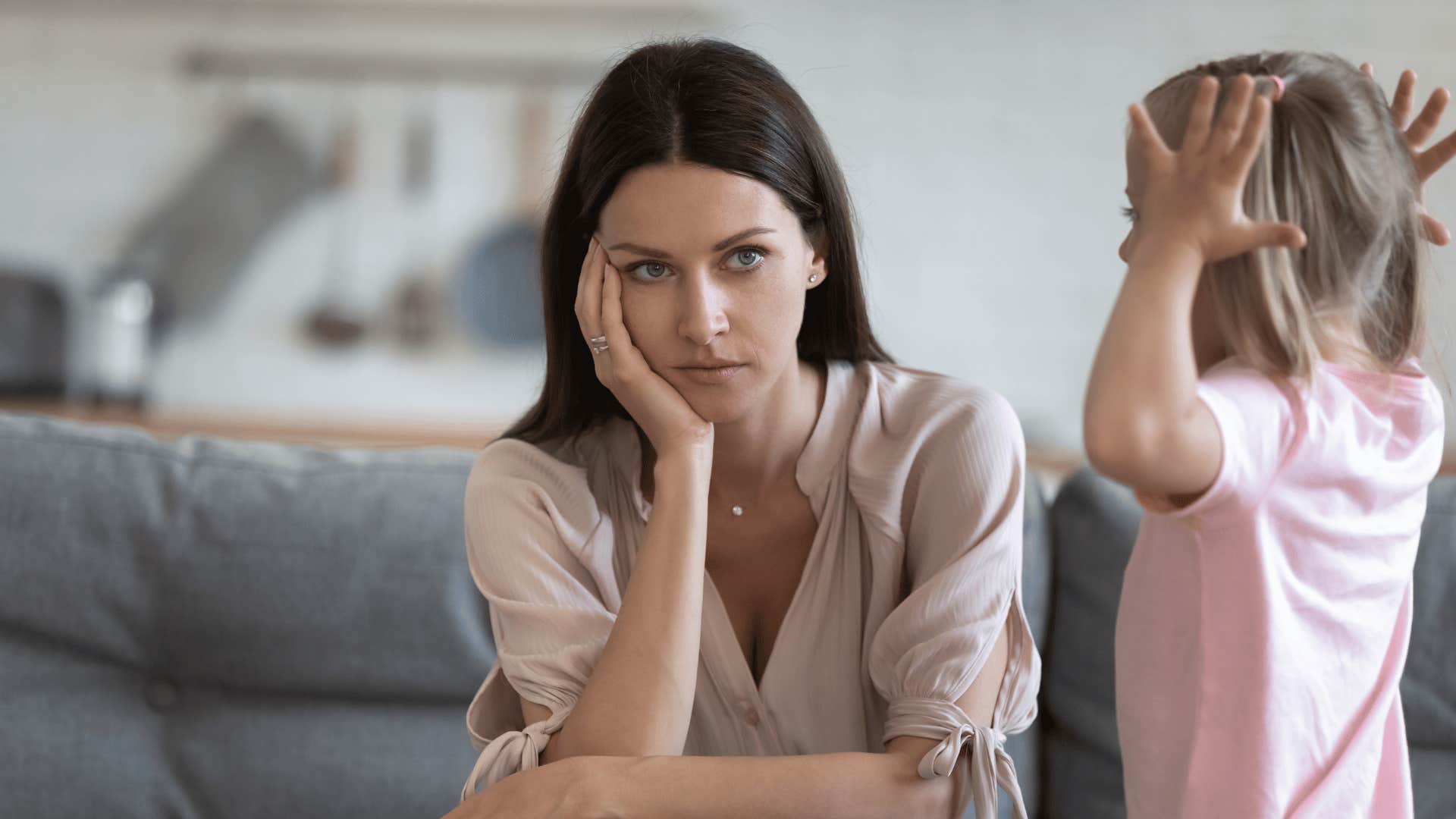 Mom who had a hard time setting boundaries when her gen z kids were little looks annoyed
