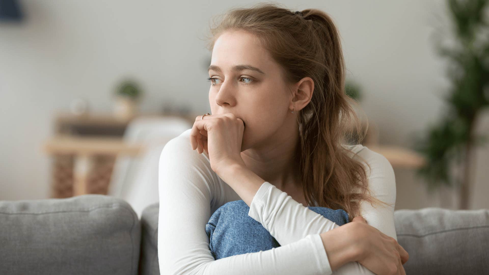sad woman with financial anxiety feeling overwhelmed