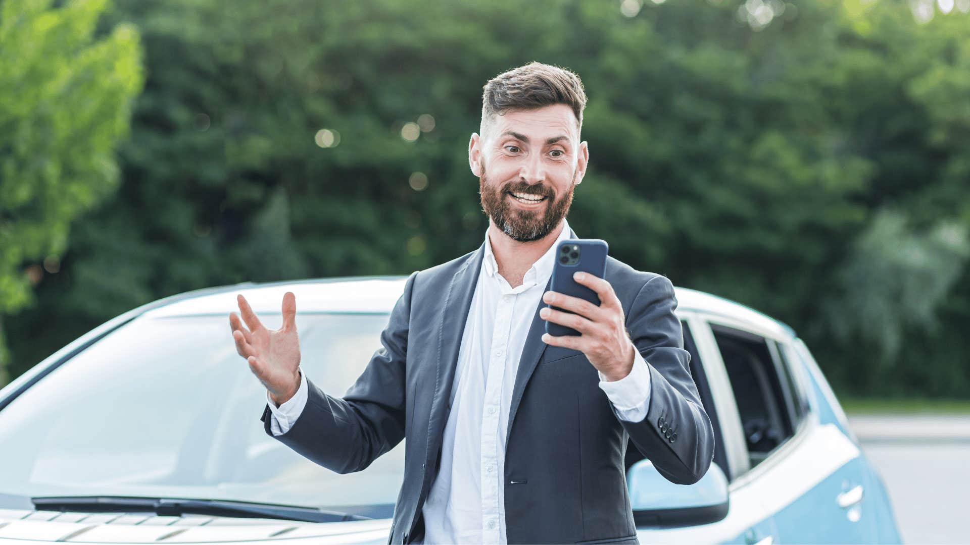 arrogant man standing in front of expensive car to prove his worth
