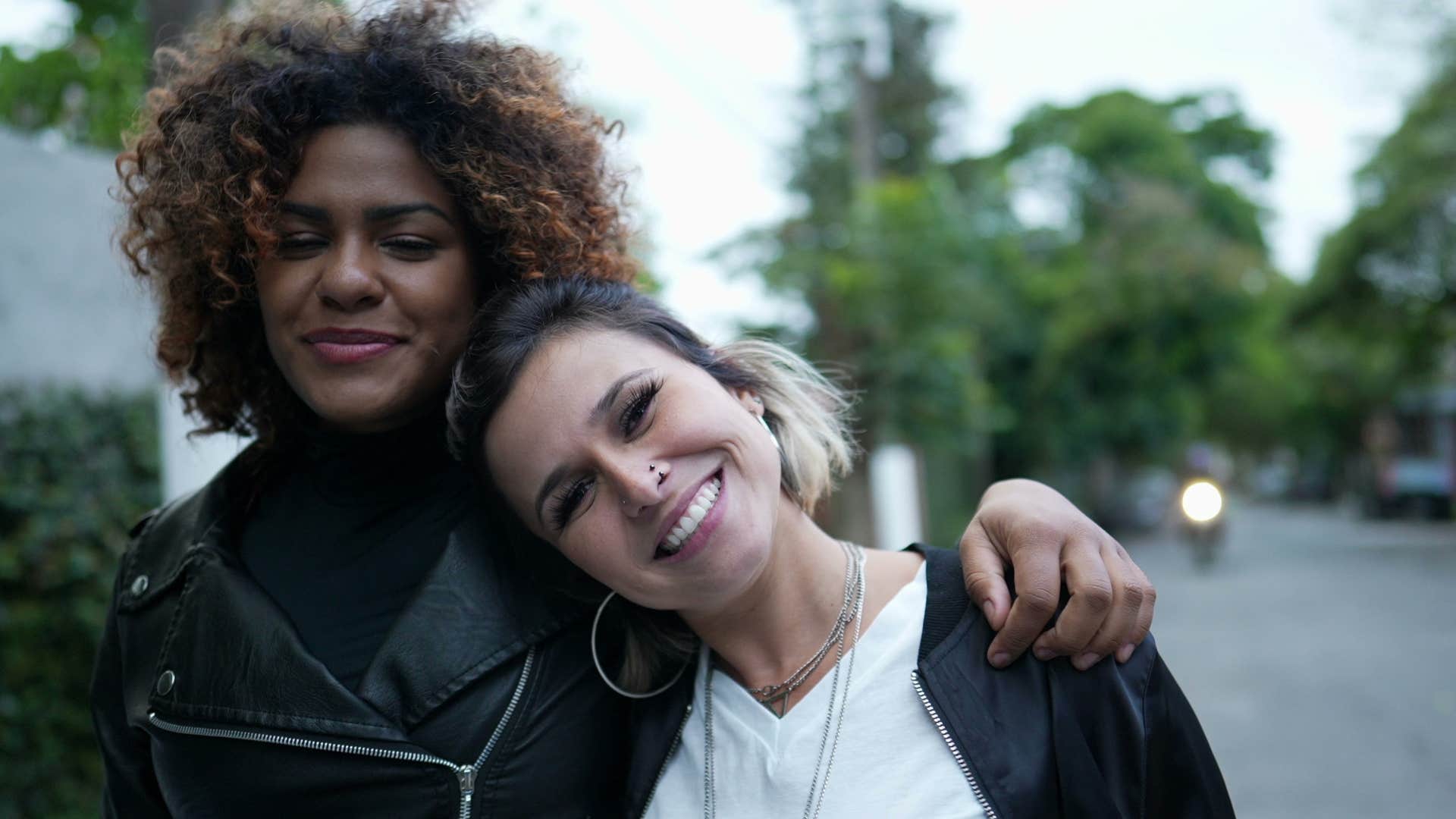 two best friends who are intentional with their energy smiling together