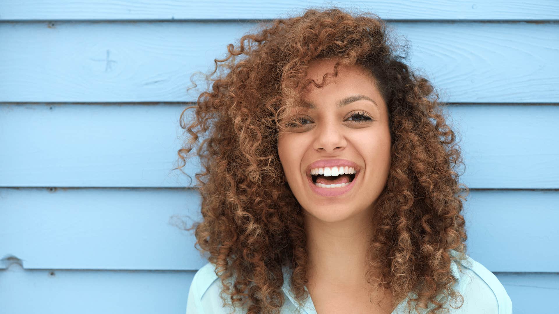 Happy young woman whose parents did an exceptional job raising her